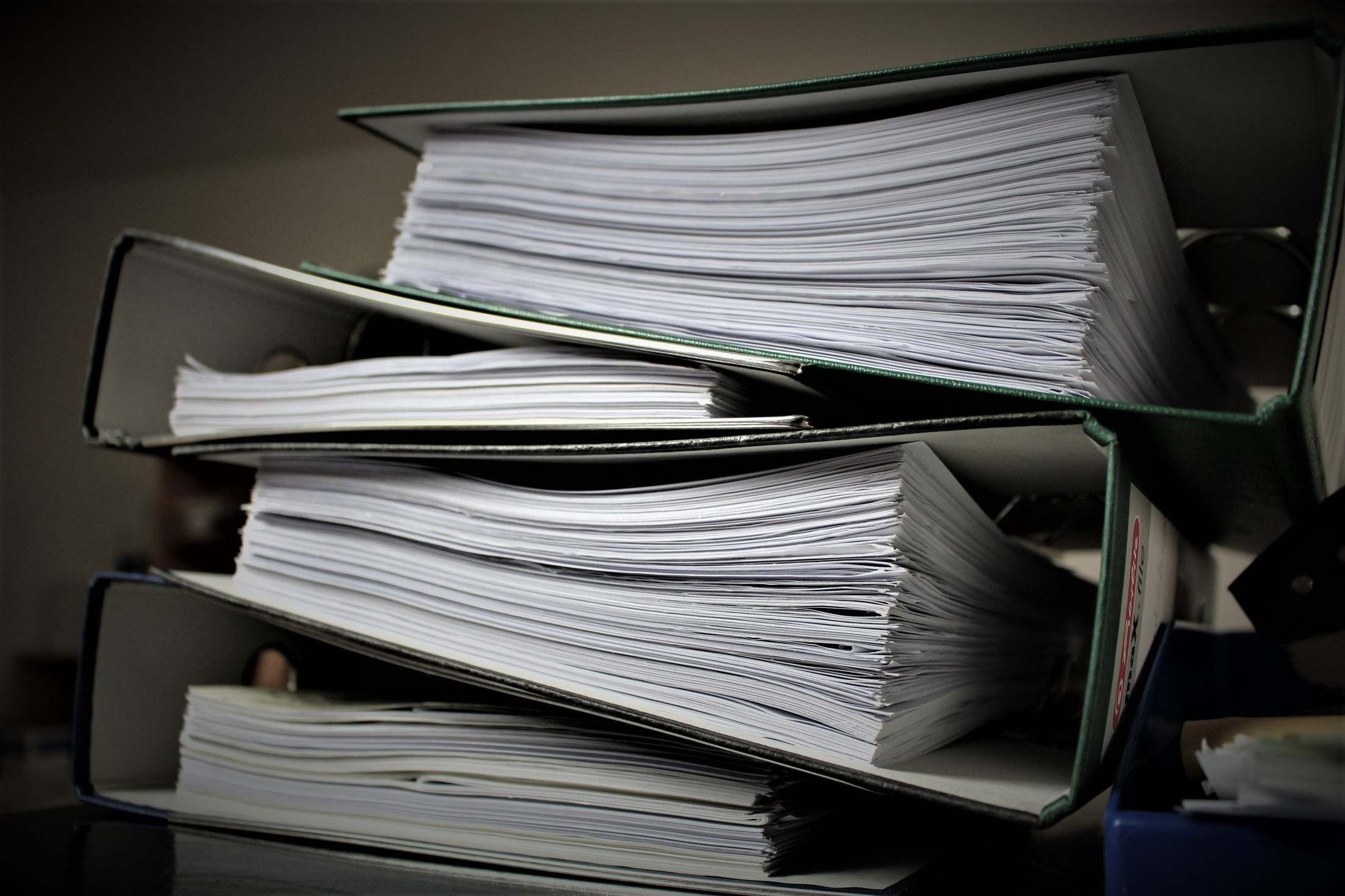 Overhead view of organized documents and folders on a desk